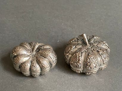 Two metal pill boxes in the shape of gourds
and...