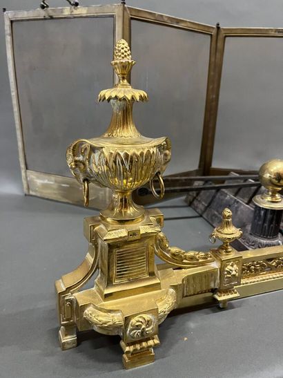 Gilt bronze hearth bar with vase decoration.
19th...