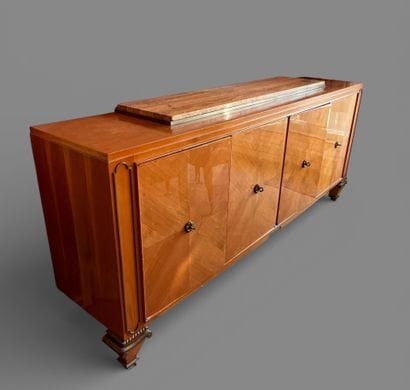 Light wood veneered sideboard opening to...