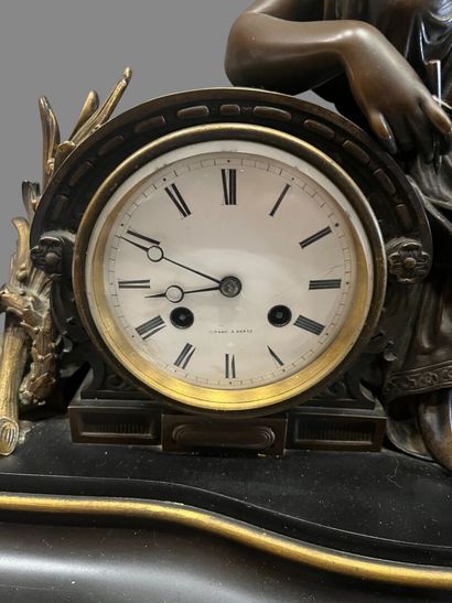 Bronze mantel clock with brown and gilded...