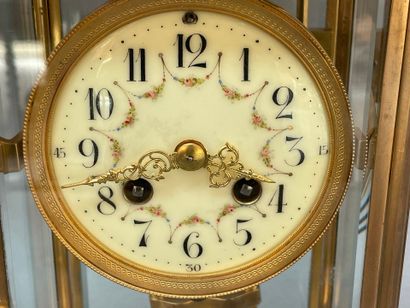 Pendule cage en laiton, le plateau en onyx...