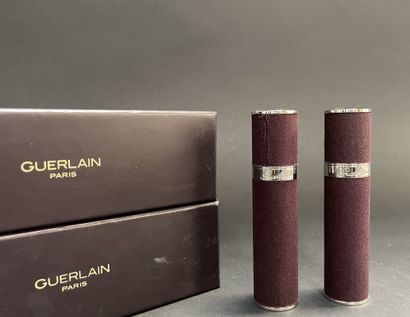 GUERLAIN
Two fabric-covered metal perfume...