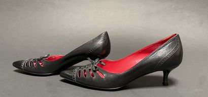 CELINE
Pair of black leather pumps with a...