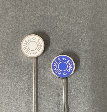 HERMÈS Paris 
Set of two lapel pins, each...