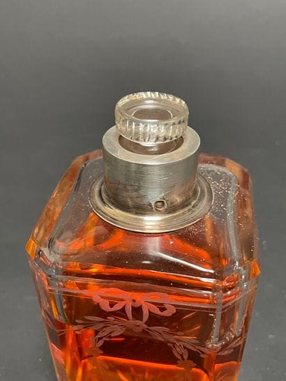 Set of four glass bottles with silver mounts...