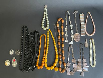 Four metal pendants, 
including “St. Francis...