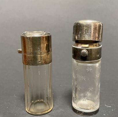 Set of four glass bottles with silver mounts...