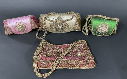 Four pouches embroidered with Indian silk.
Minor...