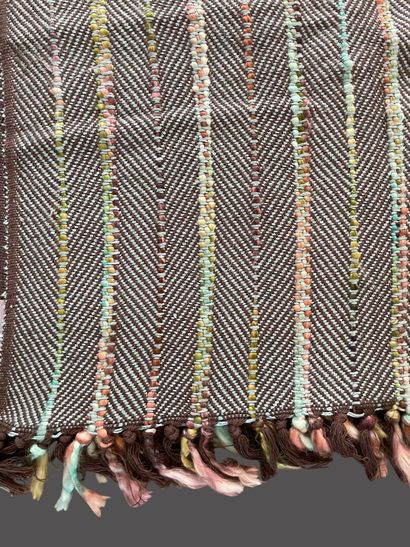 MADURA
Two plaids, one in mottled gray cotton,...