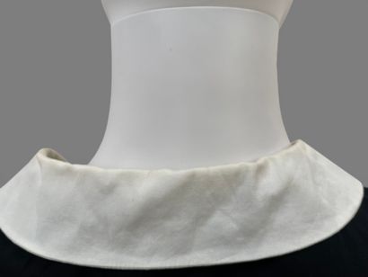 AGNES B. 
Long, sleeveless black cotton dress...