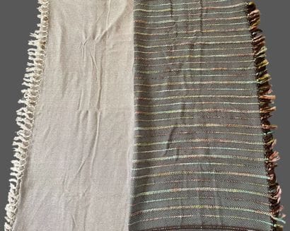 MADURA
Two plaids, one in mottled gray cotton,...