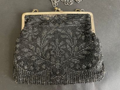 Set of six purses and pouches decorated with...