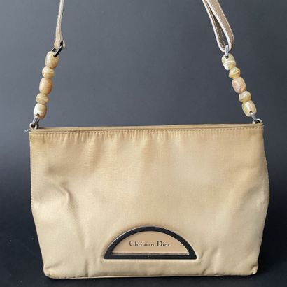 Christian DIOR
Beige nylon bag with magnetic...