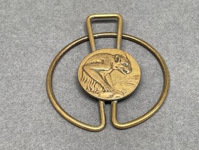 Set including a gold-plated tie clip
and...