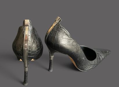 VERSACE 
Pair of black leather pumps with...