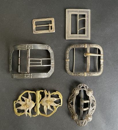 Set of six metal belt buckles, including...