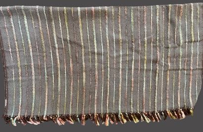 MADURA
Two plaids, one in mottled gray cotton,...
