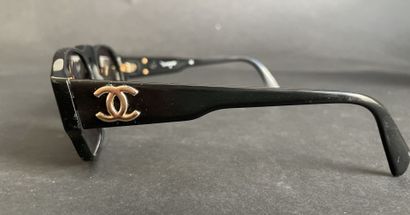 CHANEL
A pair of black composite sunglasses...