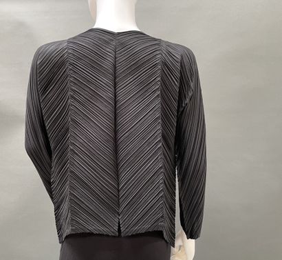 PLEATS PLEASE 
Black pleated jacket with...