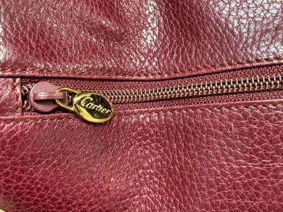 MUST by CARTIER
Burgundy grained leather...