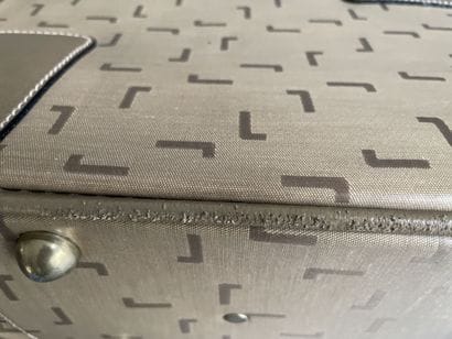 LANCEL
Two suitcases in coated canvas and...