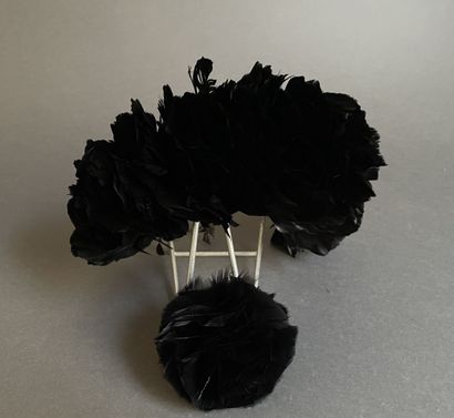 Black feather ornament and pompom.