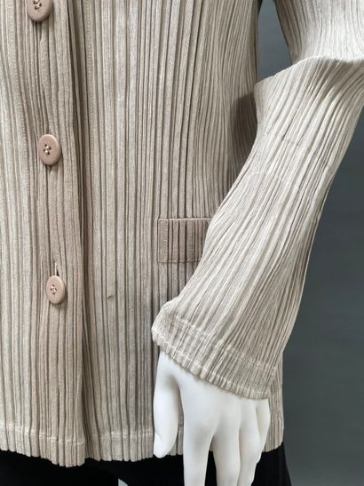 PLEATS PLEASE
Sand-beige pleated nylon jacket,...