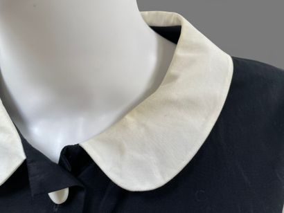 AGNES B. 
Long, sleeveless black cotton dress...