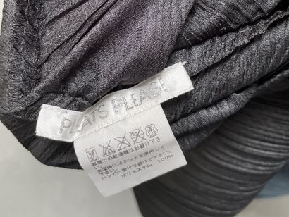 PLEATS PLEASE 
Black pleated jacket with...