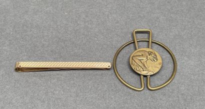 Set including a gold-plated tie clip
and...