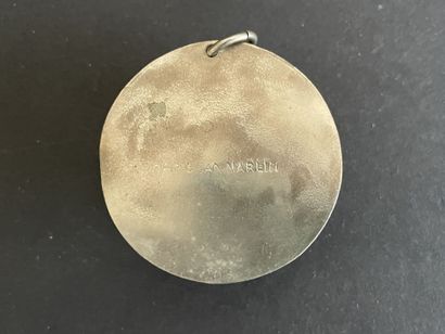 Four metal pendants, 
including “St. Francis...