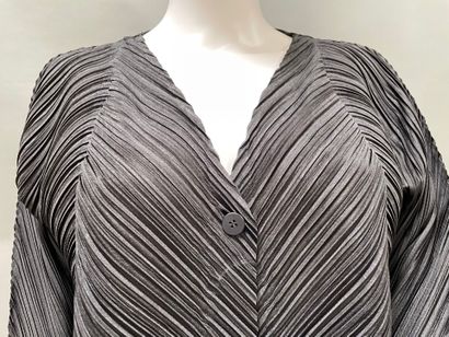 PLEATS PLEASE 
Black pleated jacket with...