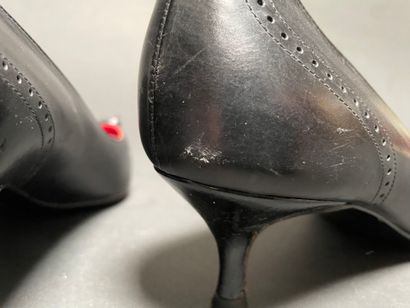 CELINE
Pair of black leather pumps with a...