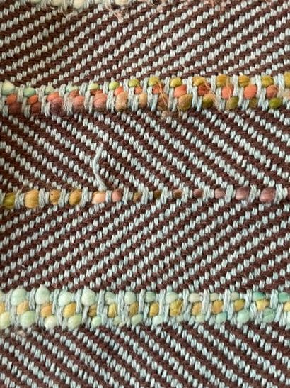 MADURA
Two plaids, one in mottled gray cotton,...