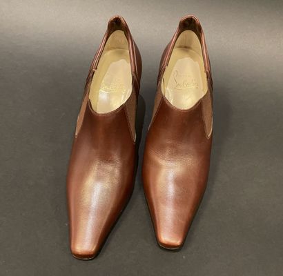 Christian LOUBOUTIN 
Brown leather low boots...