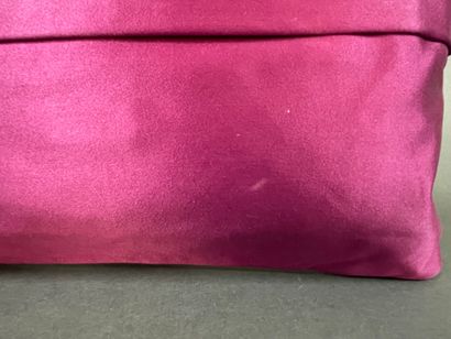 PRADA 
Burgundy satin clutch with a zipper...