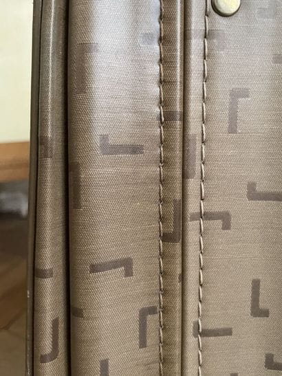 LANCEL
Two suitcases in coated canvas and...