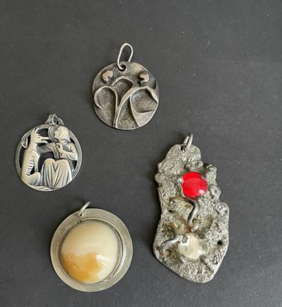 Four metal pendants, 
including “St. Francis...