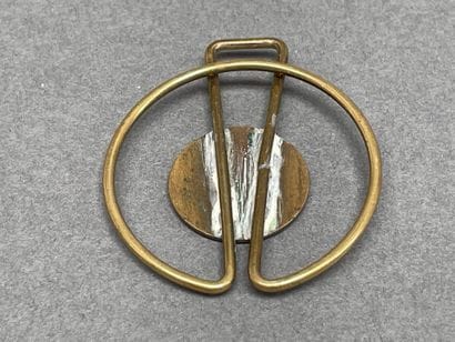 Set including a gold-plated tie clip
and...