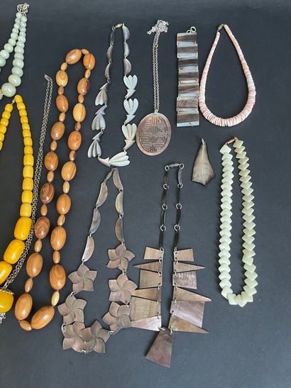 Four metal pendants, 
including “St. Francis...