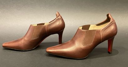 Christian LOUBOUTIN 
Brown leather low boots...