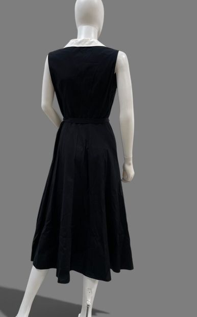 AGNES B. 
Long, sleeveless black cotton dress...