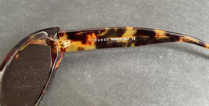 GUCCI
Pair of tortoiseshell-style sunglasses...