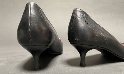CELINE
Pair of black leather pumps with a...