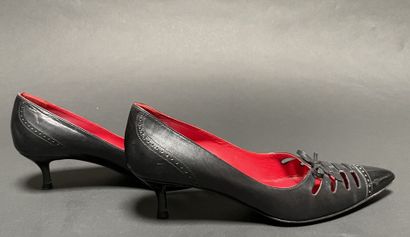 CELINE
Pair of black leather pumps with a...