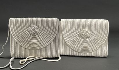 A REVIVED TRADITION
Two small trimmings bags,...