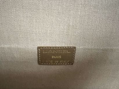 LANCEL
Two suitcases in coated canvas and...