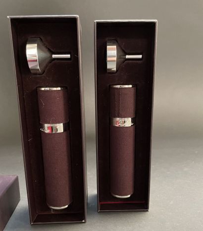 GUERLAIN
Two fabric-covered metal perfume...