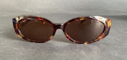 GUCCI
Pair of tortoiseshell-style sunglasses...