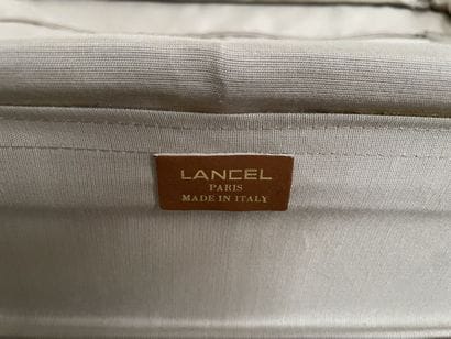 LANCEL
Two suitcases in coated canvas and...